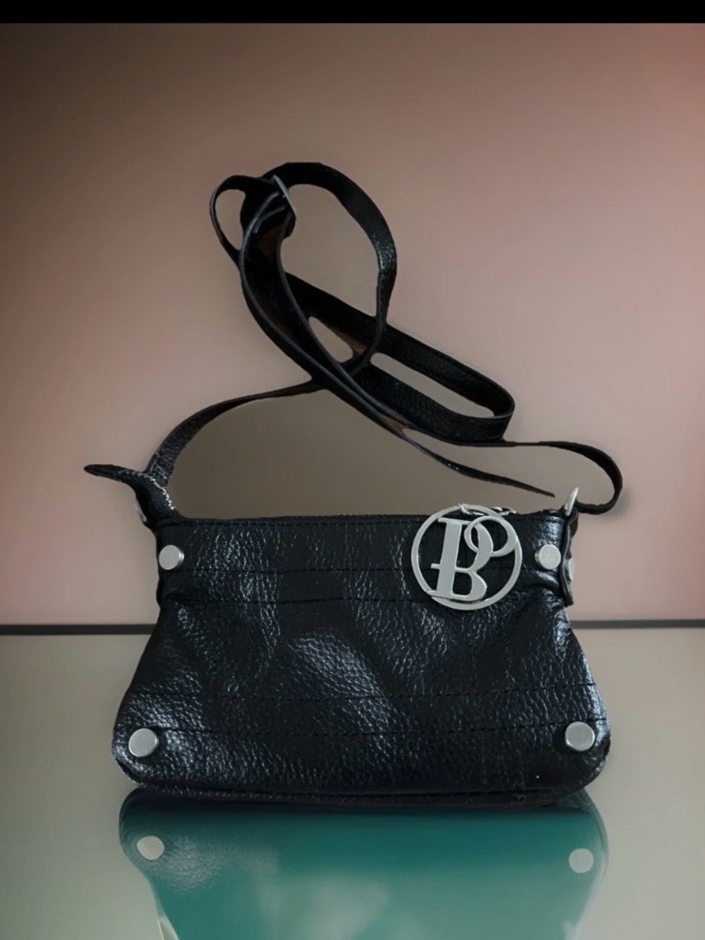 Bolzano Black Leather Mini Zip Crossbody Bag approximately 4x 7 in